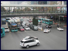 The buses of Shenzhen are turqouise coloured. As you can see, most cars are very new, and there are many European and Japanese luxury cars in Shenzhen and many other big cities in China nowadays.